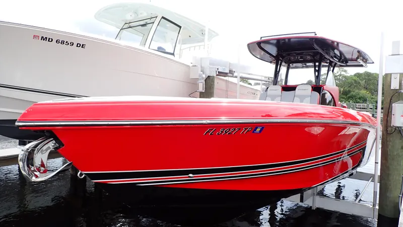 Slide: The Image of Red 2024 Statement 350 Open boat docked beside another vessel. - 3