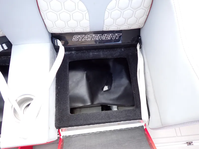 Slide: The Image of 2024 Statement 350 Open boat seat storage compartment with cup holder and hexagonal pattern. - 30