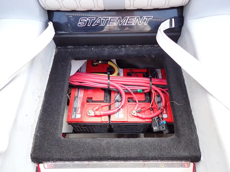 Slide: The Image of 2024 Statement 350 Open boat battery compartment with red cables. - 31
