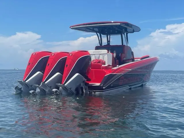 Slide: The Image of 2024 Statement 350 Open boat with triple engines on calm water. - 4