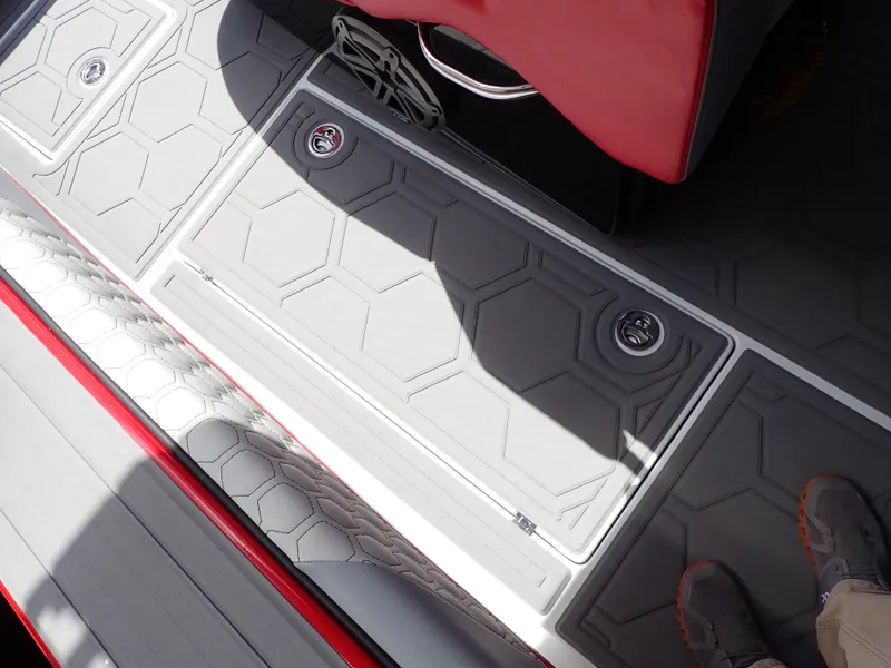 Slide: The Image of 2024 Statement 350 Open boat deck with hexagonal pattern and red seating. - 43