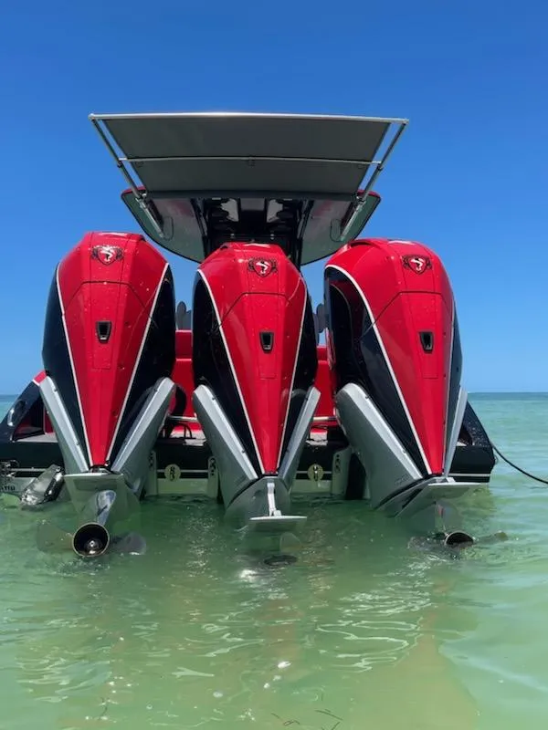 Slide: The Image of 2024 Statement 350 Open boat with three powerful red outboard engines. - 5