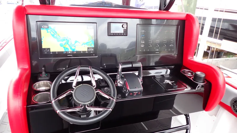 Slide: The Image of 2024 Statement 350 Open boat dashboard with navigation screens and steering wheel. - 7