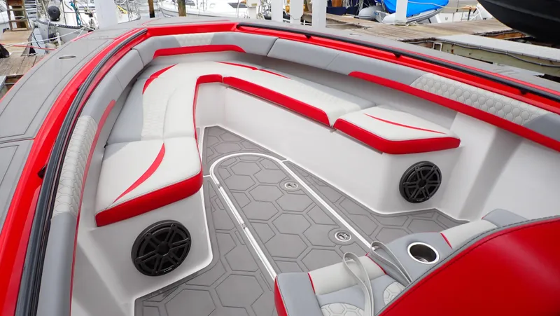 Slide: The Image of 2024 Statement 350 Open boat interior with red and white seating, hexagonal flooring, and speakers. - 8