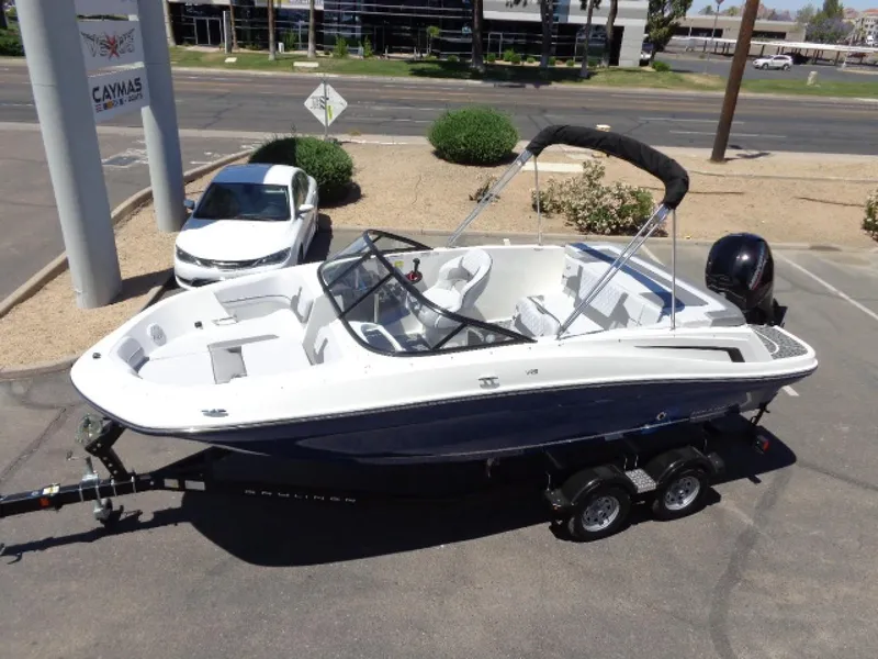 Slide: The Image of 2023 Bayliner VR5 Bowrider OB boat on trailer in parking lot. - 12