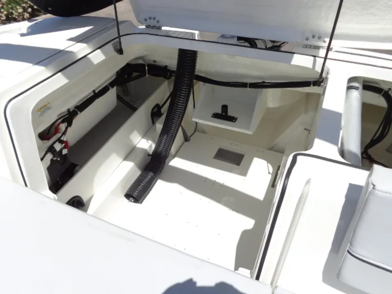 Slide: The Image of 2023 Bayliner VR5 Bowrider OB engine compartment with open hatch and visible components. - 2