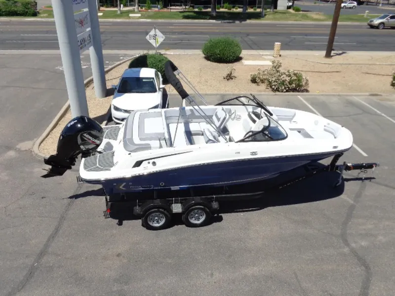 Slide: The Image of 2023 Bayliner VR5 Bowrider OB on trailer in parking lot, aerial view. - 4