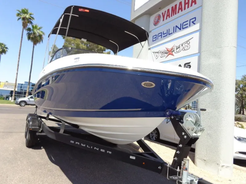 Slide: The Image of 2023 Bayliner VR5 Bowrider OB boat on trailer, displayed at dealership. - 5