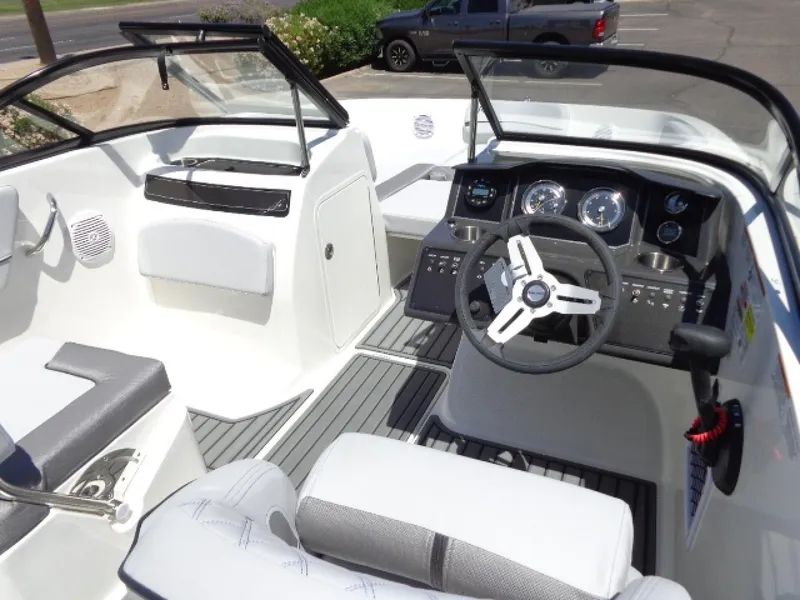 Slide: The Image of 2023 Bayliner VR5 Bowrider OB interior with modern dashboard and seating. - 6