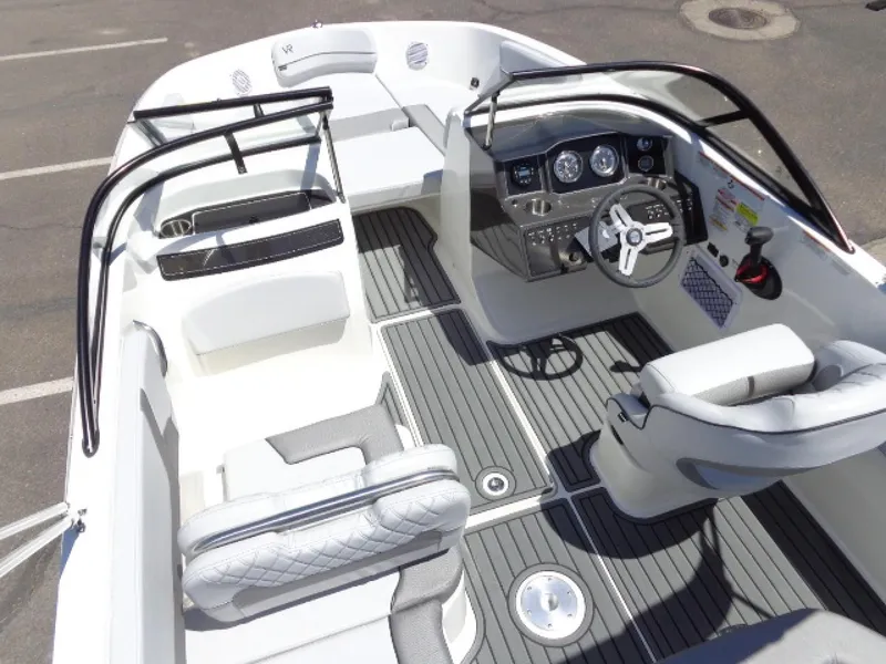 Slide: The Image of 2023 Bayliner VR5 Bowrider OB interior with sleek seating and modern dashboard. - 7