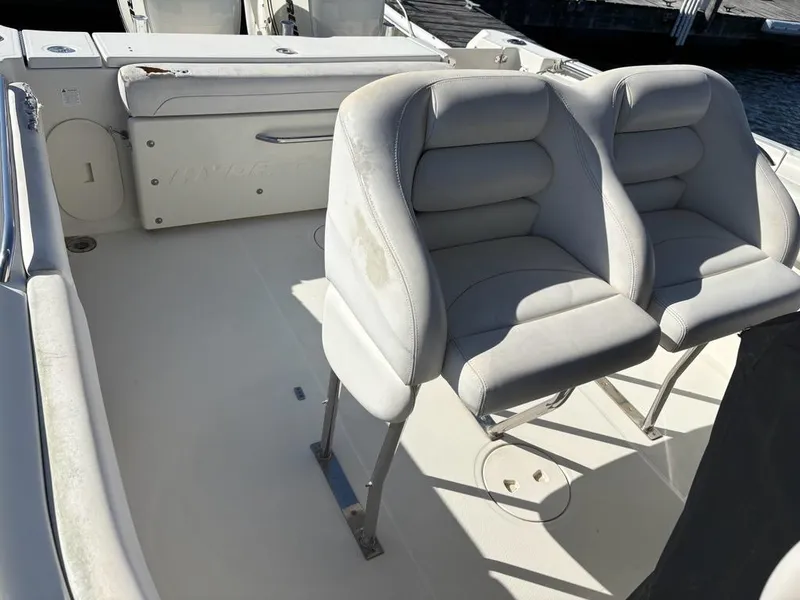 Slide: The Image of 2012 Hydra-Sports 2500 CC boat interior with cushioned seating and spacious deck. - 14