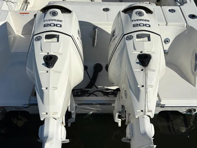 Slide: The Image of Twin Evinrude 200 engines on a 2012 Hydra-Sports 2500 CC boat. - 15
