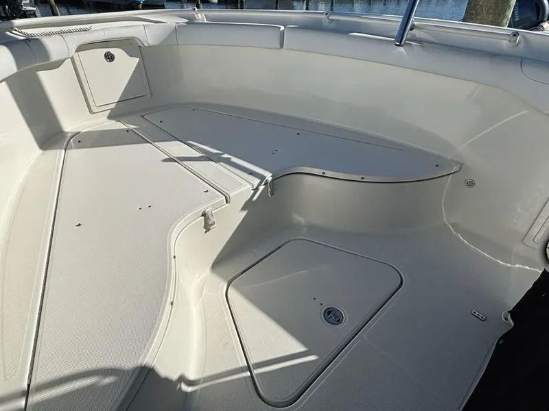 Slide: The Image of 2012 Hydra-Sports 2500 CC boat interior, featuring spacious deck and storage compartments. - 6