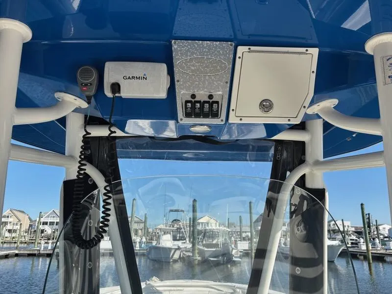 Slide: The Image of 2012 Hydra-Sports 2500 CC boat console with Garmin equipment at a marina. - 8