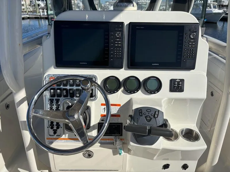 Slide: The Image of Control panel of a 2012 Hydra-Sports 2500 CC boat with dual Garmin displays. - 9