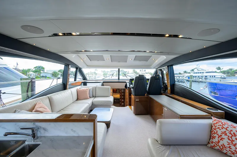 Slide: The Image of Luxurious interior of 2018 Princess 65S yacht with modern seating and panoramic windows. - 11