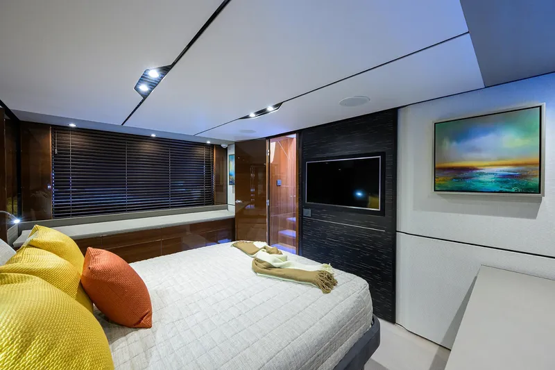 Slide: The Image of Luxurious bedroom interior of 2018 Princess 65S yacht with modern decor and vibrant cushions. - 22