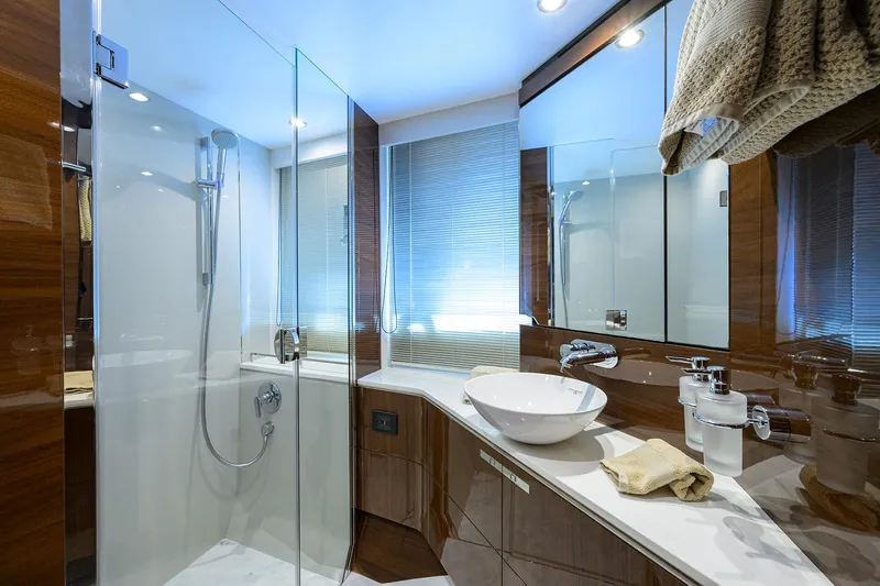 Slide: The Image of Luxurious bathroom in 2018 Princess 65S yacht with modern fixtures and glass shower. - 28