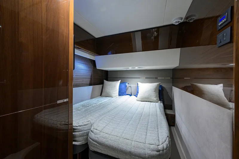 Slide: The Image of Luxurious cabin interior of 2018 Princess 65S yacht with twin beds and modern decor. - 30
