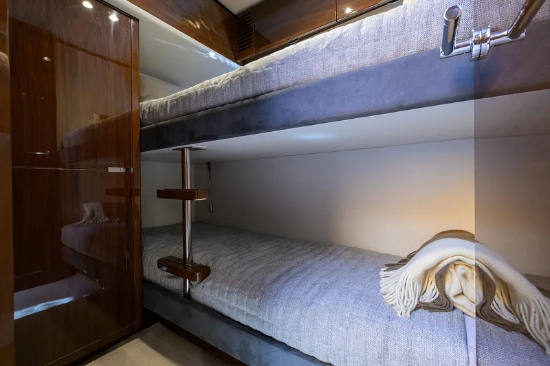 Slide: The Image of Bunk beds in 2018 Princess 65S yacht cabin with cozy blankets. - 32
