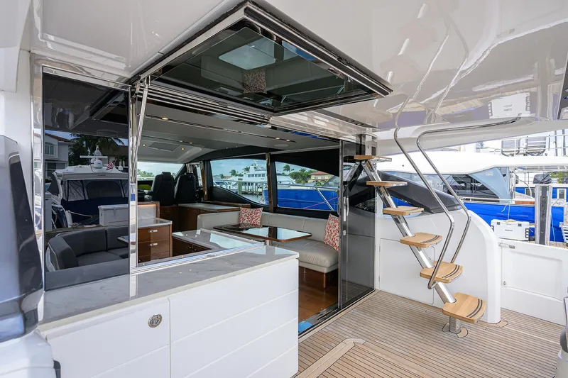 Slide: The Image of Luxurious 2018 Princess 65S yacht interior with modern seating and elegant staircase. - 38