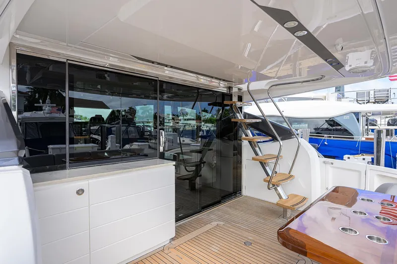 Slide: The Image of Luxurious 2018 Princess 65S yacht interior with modern design and elegant wooden accents. - 39