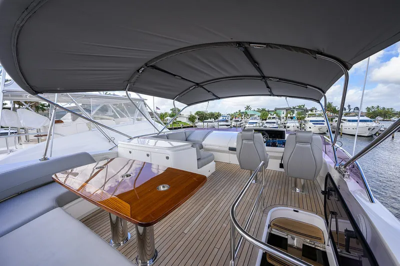 Slide: The Image of Luxurious 2018 Princess 65S yacht deck with seating and dining area. - 43