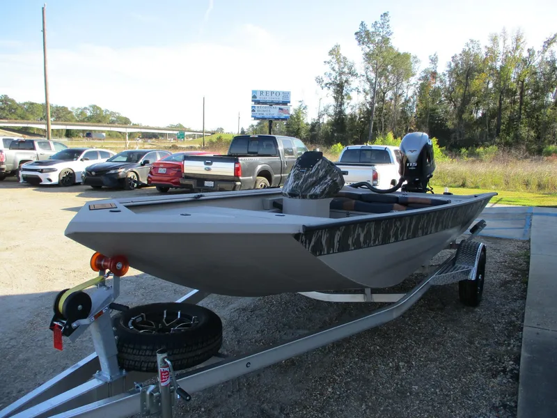 Slide: The Image of 2025 Avid 18 Rogue SC boat on trailer in parking lot. - 3