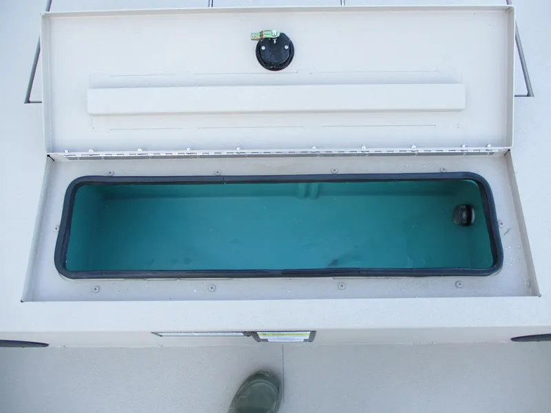 Slide: The Image of Open storage compartment in 2025 Avid 18 Rogue SC boat. - 9