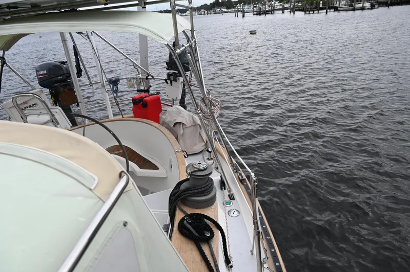 Slide: The Image of 1984 Southern Cross 39 sailboat on calm water, featuring deck and cockpit view. - 15