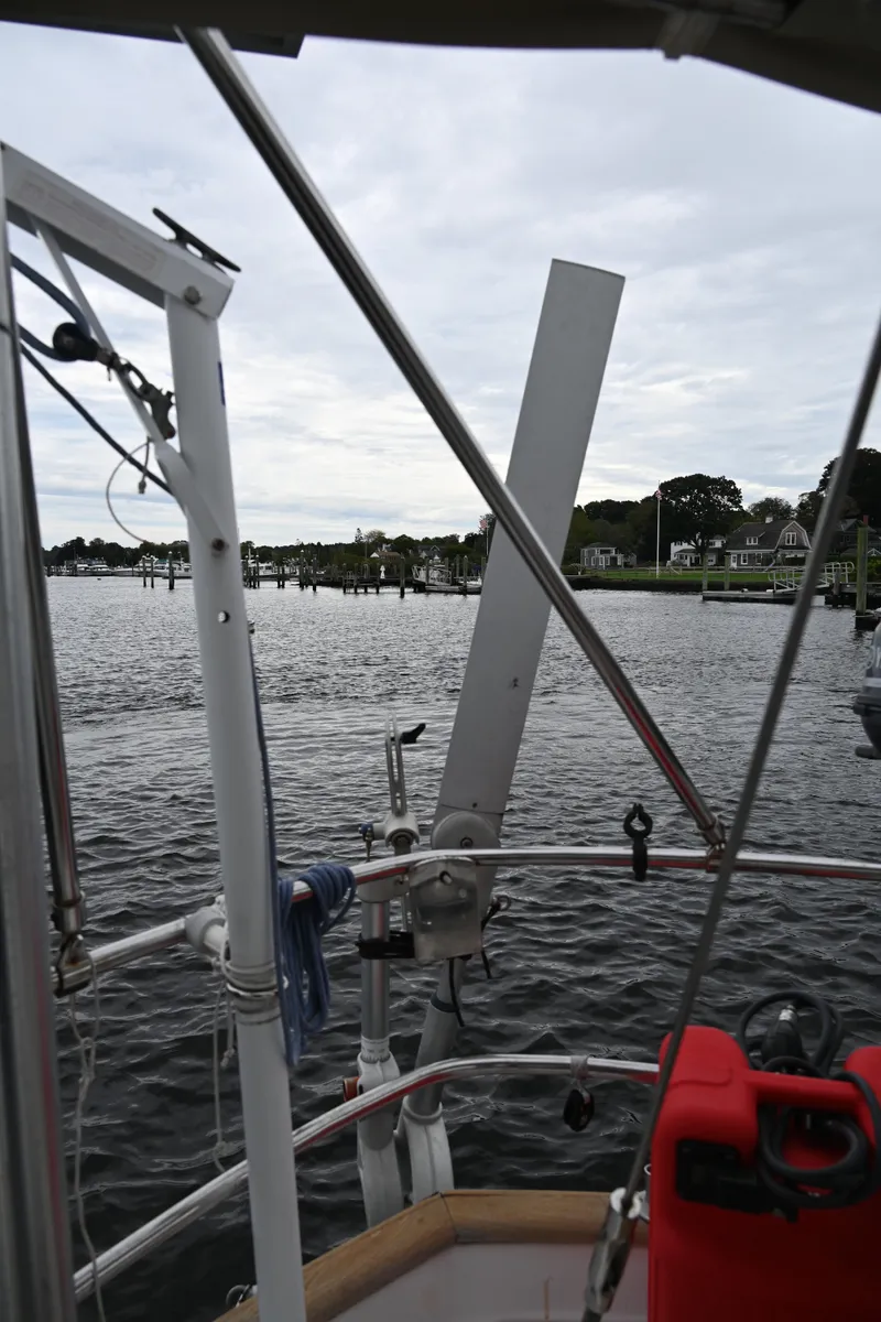 Slide: The Image of View from 1984 Southern Cross 39 sailboat, featuring water and shoreline in the background. - 26