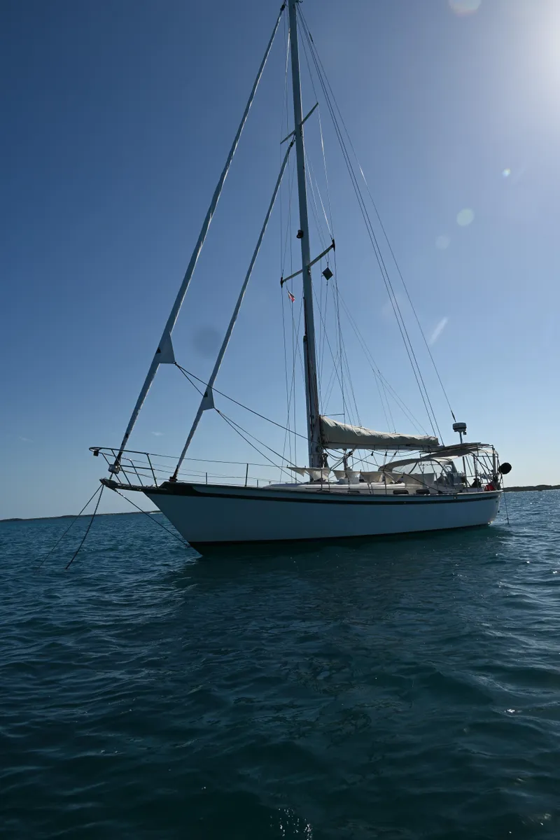 Slide: The Image of 1984 Southern Cross 39 sailboat on calm water under clear sky. - 27