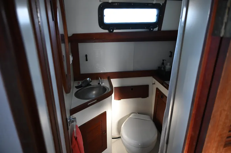 Slide: The Image of Compact bathroom in 1984 Southern Cross 39 sailboat with sink and toilet. - 45