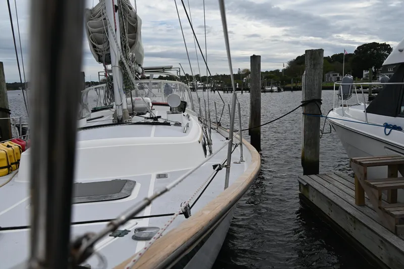 Slide: The Image of 1984 Southern Cross 39 sailboat docked at a marina under cloudy skies. - 7