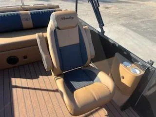 Slide: The Image of 2025 Bentley Pontoons 253 Elite Swingback Dual Captain seat with cup holders on deck. - 10