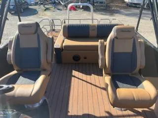 Slide: The Image of 2025 Bentley Pontoons 253 Elite Swingback Dual Captain interior with luxurious seating. - 4