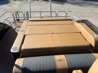 Slide: The Image of 2025 Bentley Pontoons 253 Elite Swingback Dual Captain, luxurious seating area on a pontoon boat. - 6