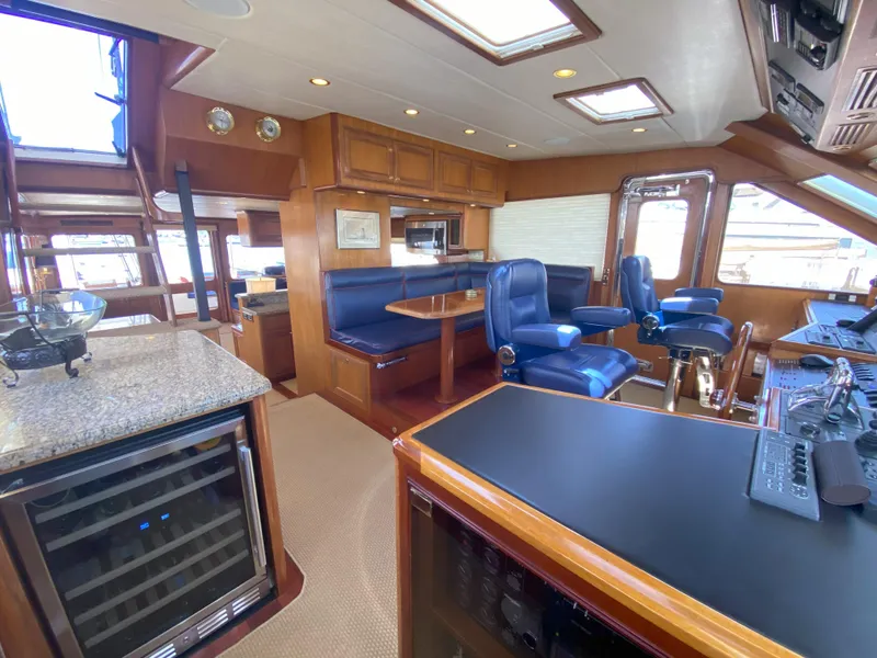 Slide: The Image of Luxurious interior of a 2005 Offshore Yachts 72' featuring plush seating and modern amenities. - 10
