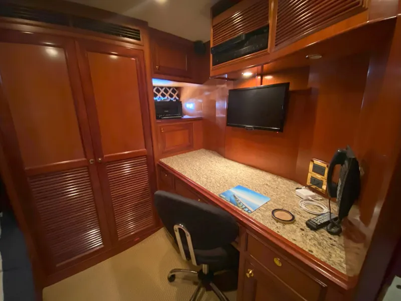 Slide: The Image of Luxurious 2005 Offshore Yachts 72' interior with elegant wood cabinetry and modern amenities. - 19