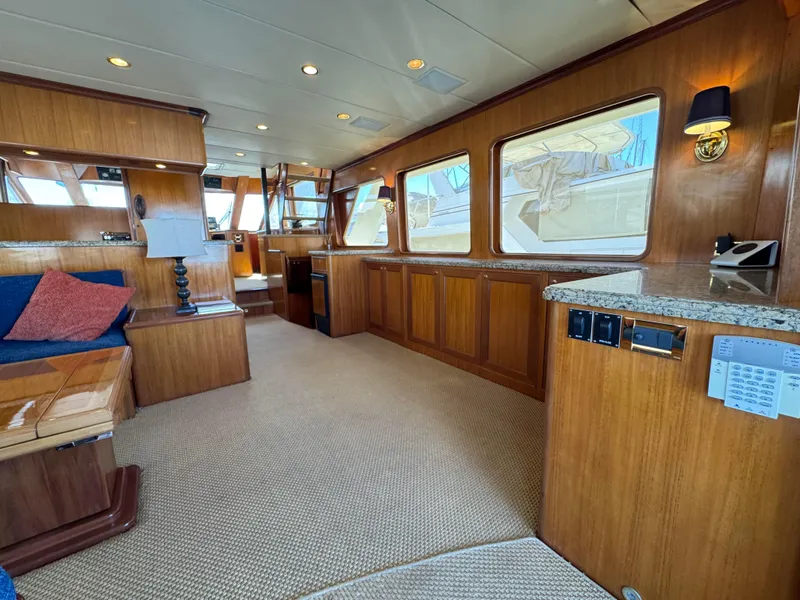 Slide: The Image of Luxurious interior of 2005 Offshore Yachts 72', featuring elegant wood finishes and spacious layout. - 4