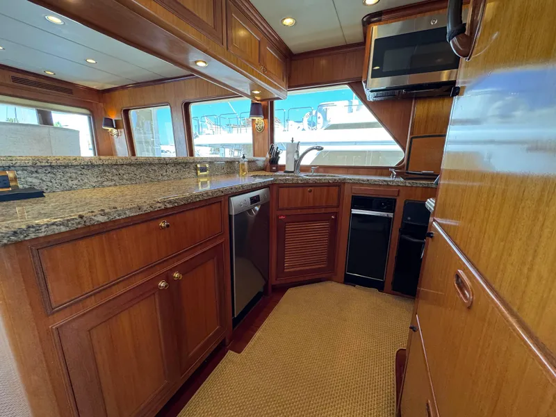 Slide: The Image of Luxurious kitchen interior of 2005 Offshore Yachts 72', featuring wood cabinetry and modern appliances. - 6