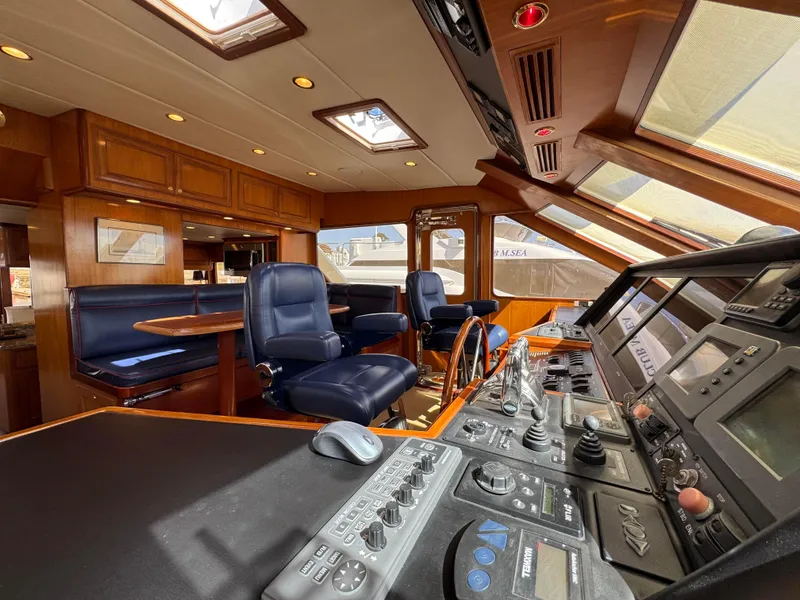 Slide: The Image of Luxurious 2005 Offshore Yachts 72' interior with modern navigation controls and plush seating. - 8