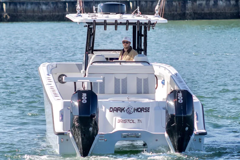 Slide: The Image of 2022 Invincible 33 Catamaran on water, featuring twin engines and sleek design. - 7