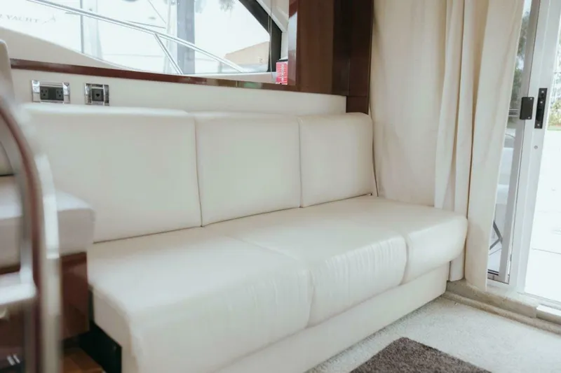 Slide: The Image of Luxurious interior of 2010 Sea Ray 390 Sedan Bridge with white leather seating. - 12