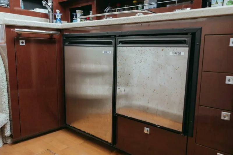 Slide: The Image of Stainless steel kitchen appliances in 2010 Sea Ray 390 Sedan Bridge yacht. - 14
