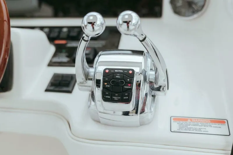Slide: The Image of Close-up of 2010 Sea Ray 390 Sedan Bridge throttle controls. - 16