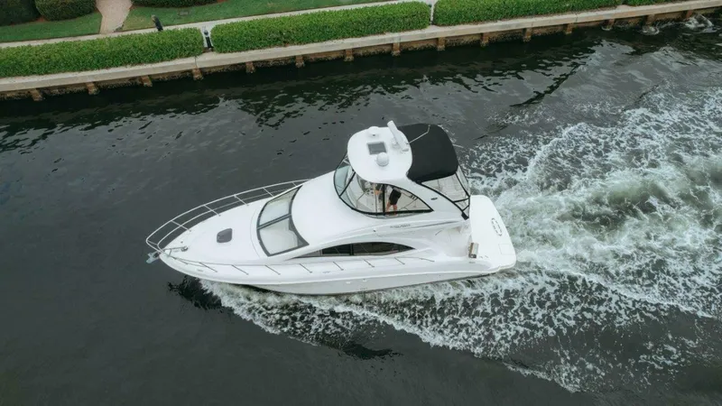 Slide: The Image of Aerial view of 2010 Sea Ray 390 Sedan Bridge cruising on a canal. - 23