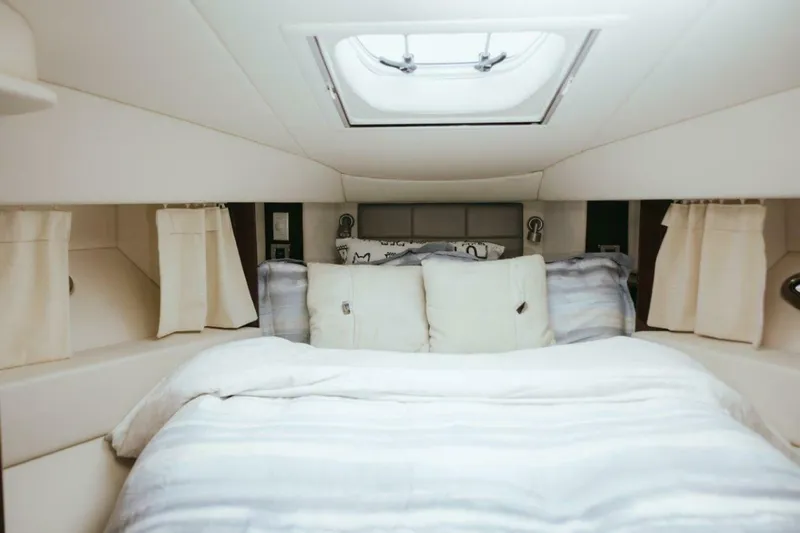 Slide: The Image of Luxurious bedroom interior of 2010 Sea Ray 390 Sedan Bridge yacht. - 4