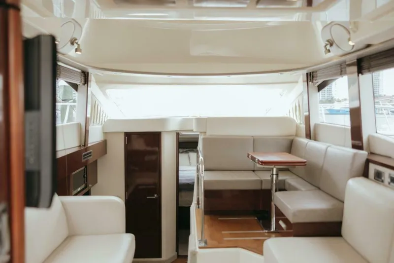 Slide: The Image of Luxurious interior of 2010 Sea Ray 390 Sedan Bridge yacht with plush seating and modern design. - 6