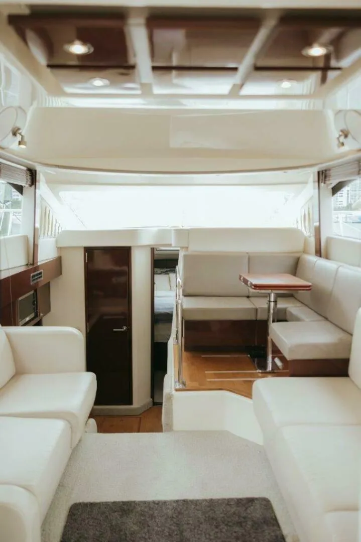 Slide: The Image of Luxurious interior of 2010 Sea Ray 390 Sedan Bridge yacht with elegant seating. - 7